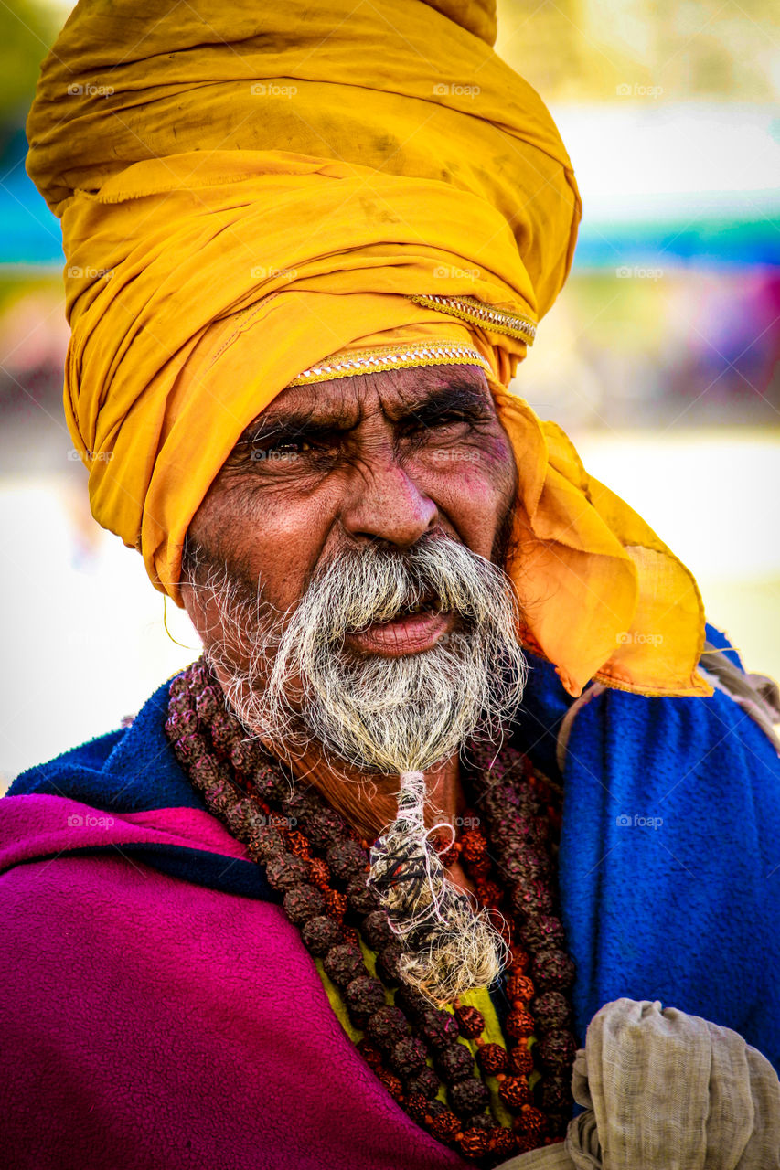 A few days ago, I came across this man in pushkar, Rajasthan. Dressed as a sadhu he was sitting on the side of a shady street in the pushkar. I could not help but stop and ask if I could photograph him. He agreed in exchange for a few rupees. I felt it was fair so I took a portrait shot of him in all his colors
