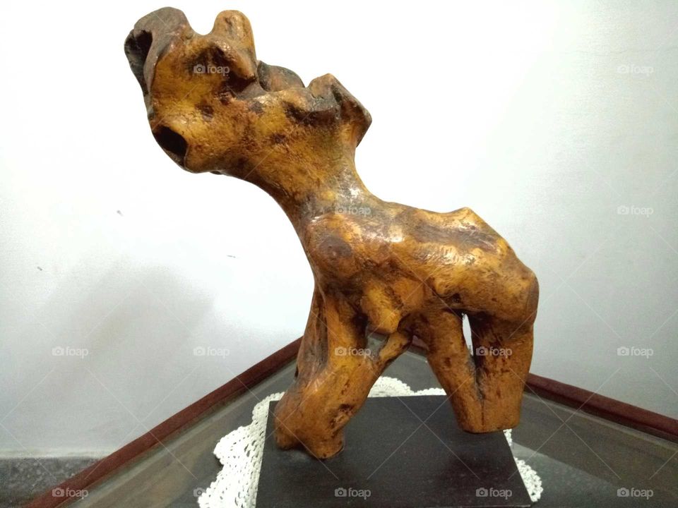 Decorative wood art and sculpture very closely resembling a puppy