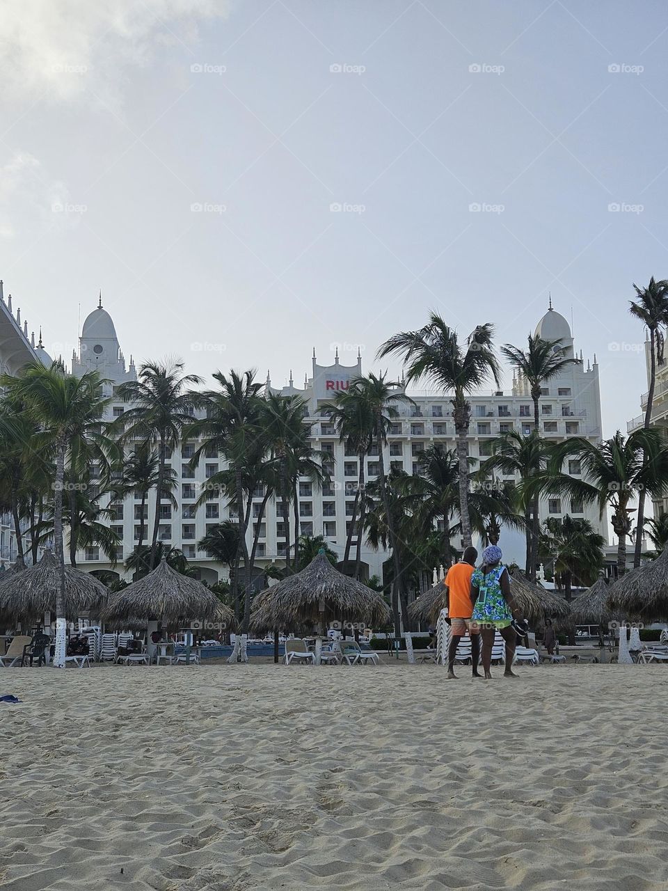 Rui Palace in Aruba.  Beach front.  couple walking on the beach.