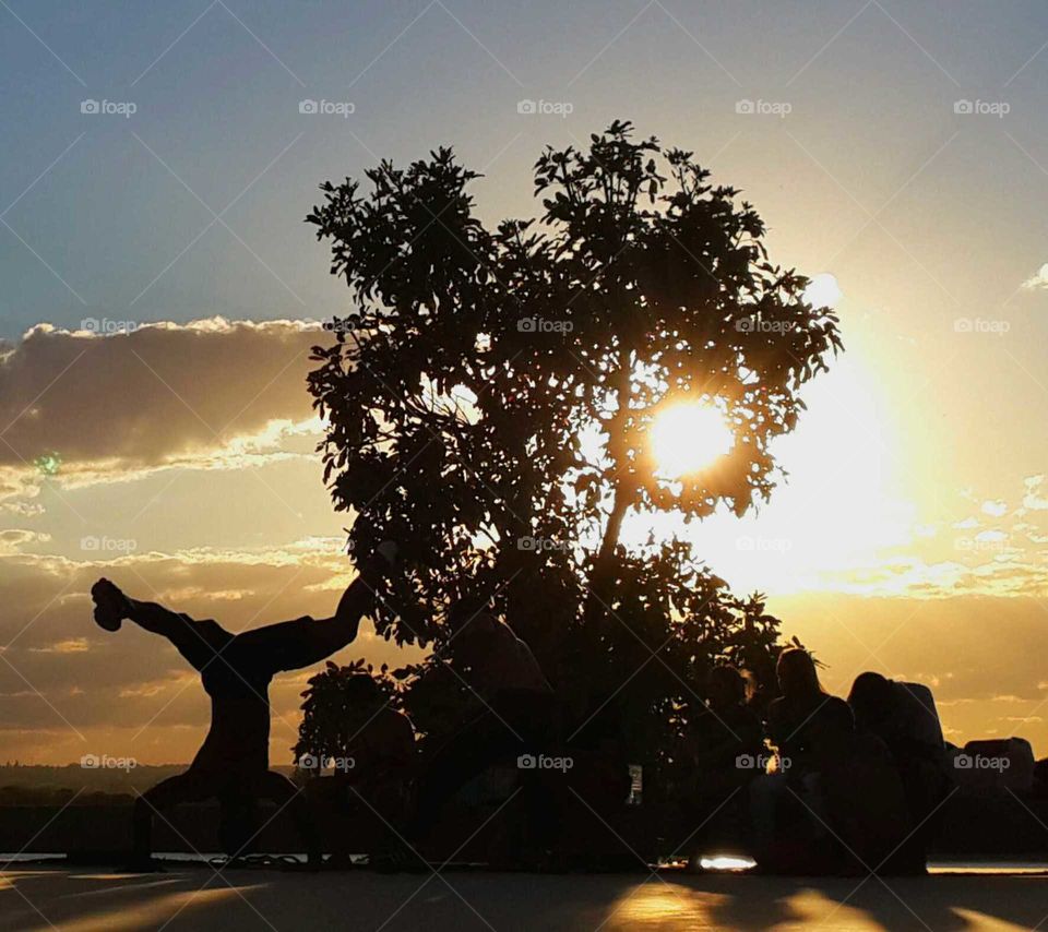 dancing capoeira. people dancing at sunset in brasil