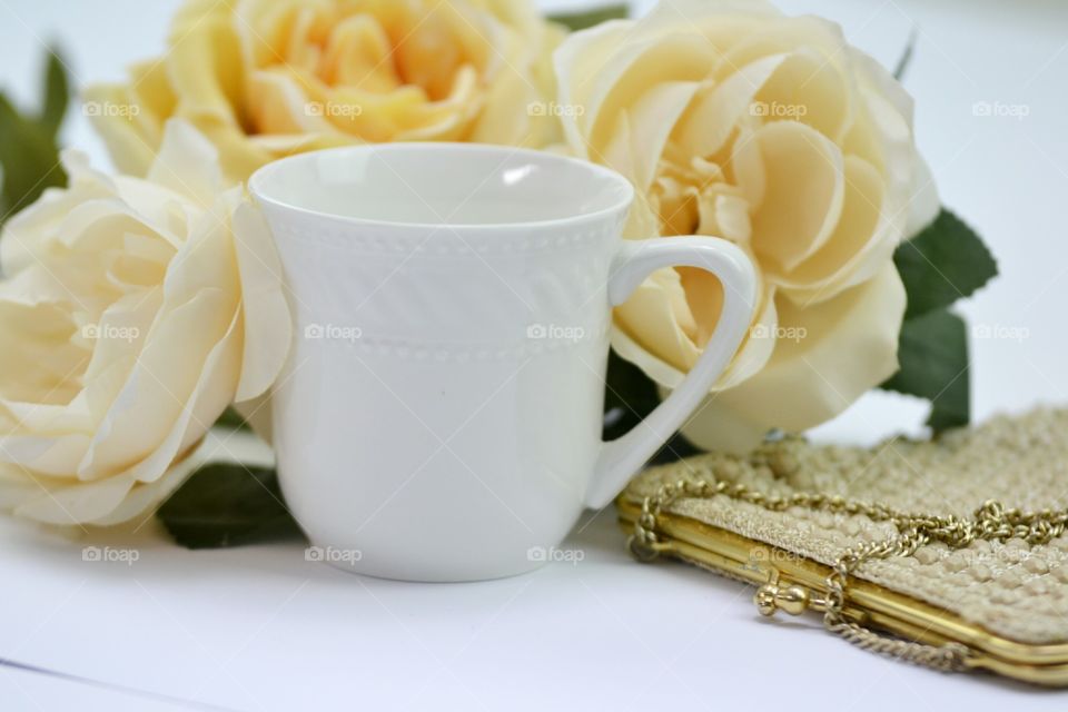 Vintage clutch,cup of coffee,yellow flowers