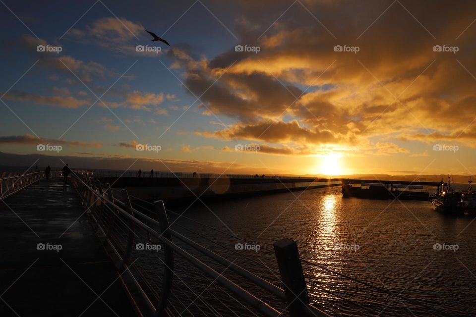 Sunset on breakwater 