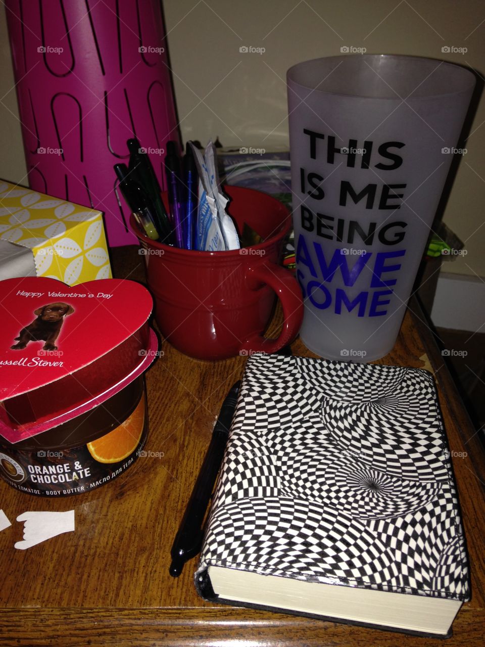 Cluttered nightstand. Always ready to write
