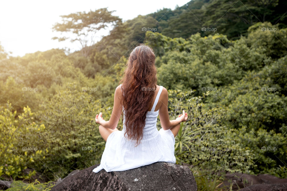 Girl doing yoga in nature