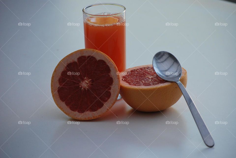 Healthy breakfast with fruit and juice , diet , orange juice, grapefruit , spoon