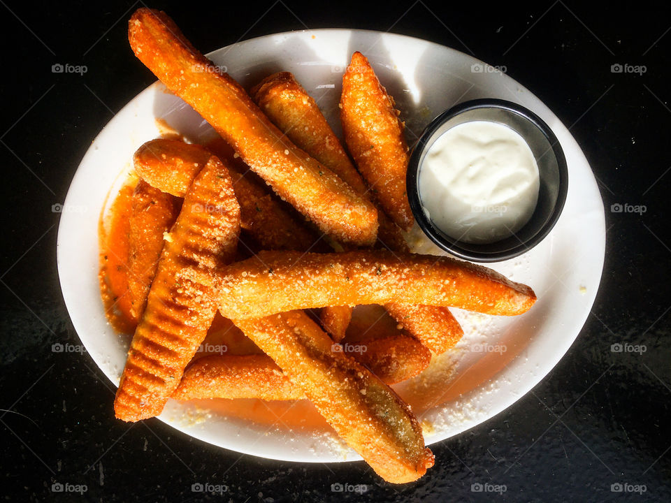 Country fried breadsticks smothered in hot sauce and served with blue cheese. Yum!