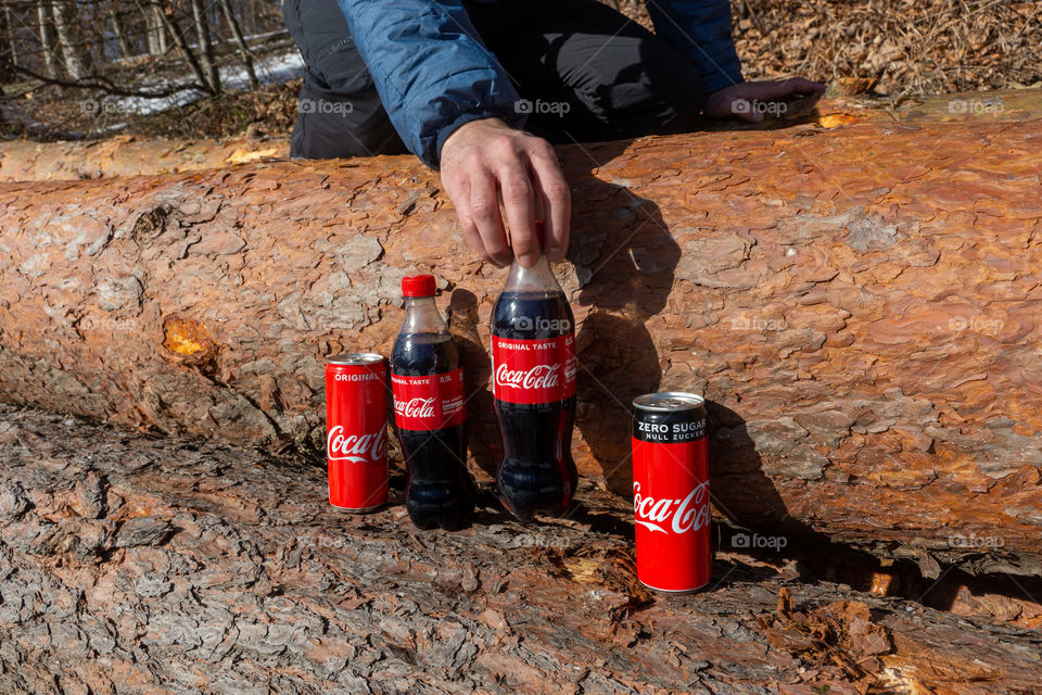 bottles and tins of Coca Cola