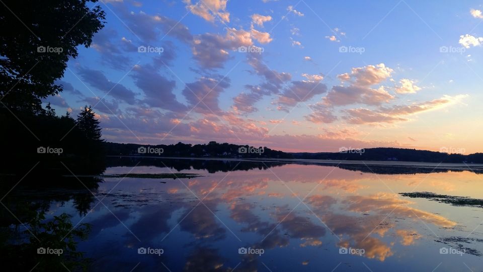 Clouds reflected on lake with dramatic sky