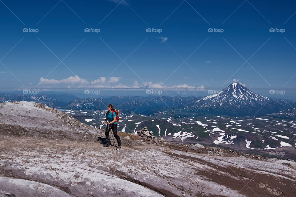 Woman hiking on mountain during winter