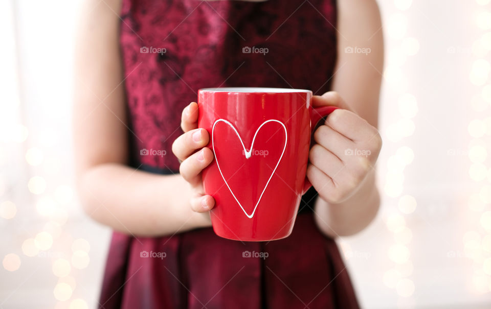 Women holding coffee cup