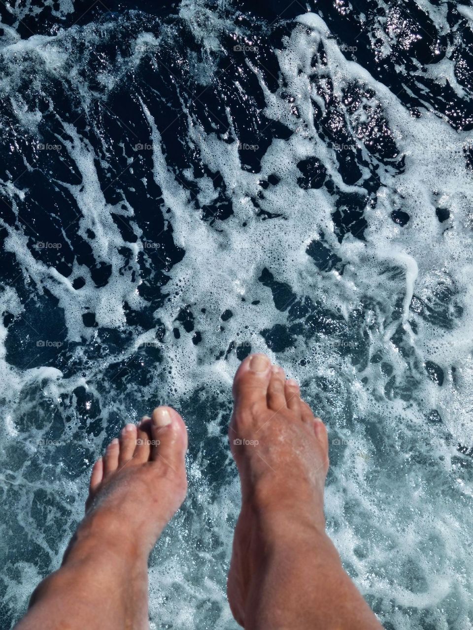 before jumping into the sea from the boat