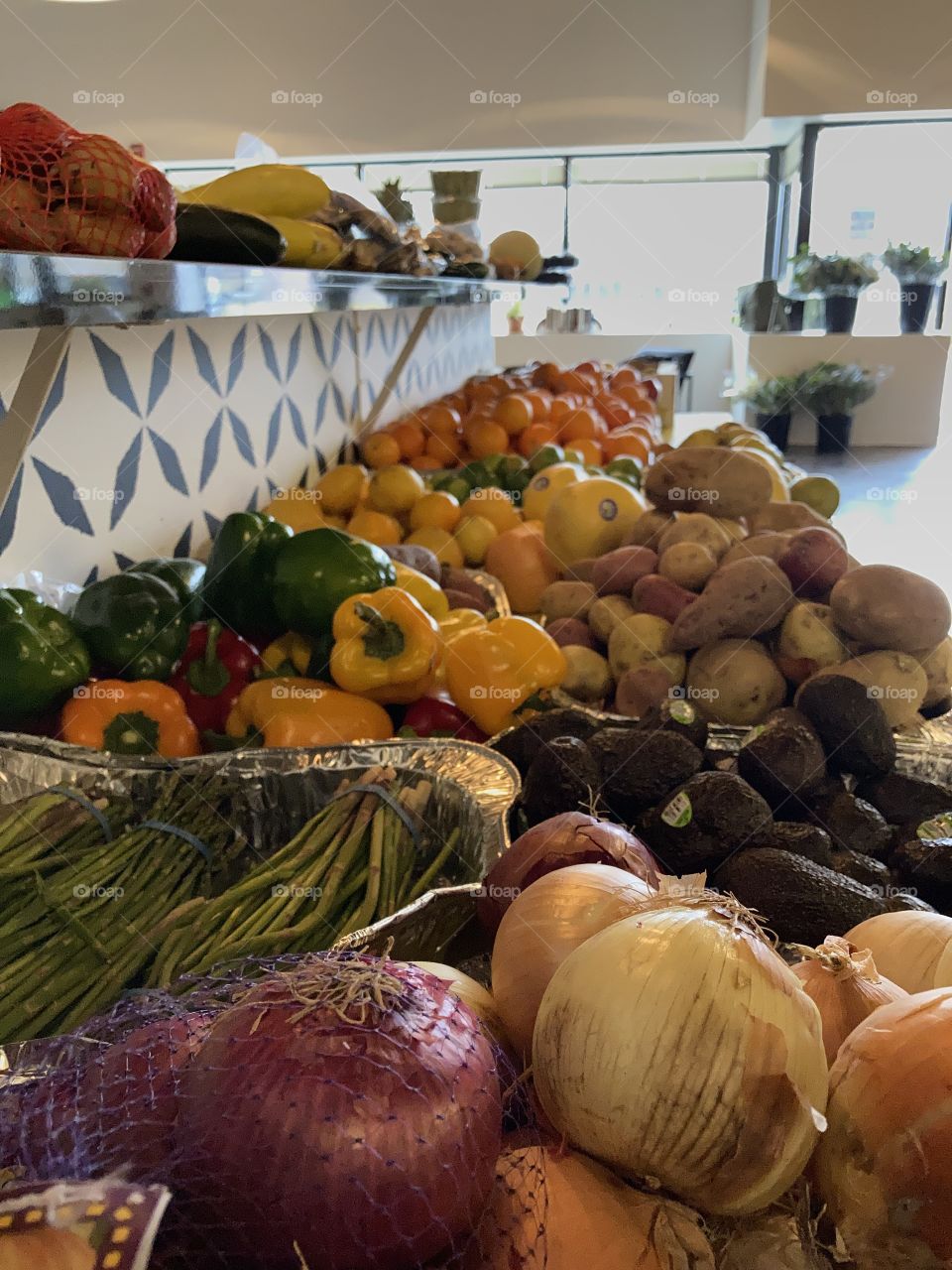 Table of brightly colored vegetables and fruit for local food assistance