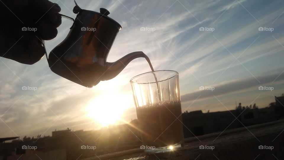 cup of coffee towards the sunset.