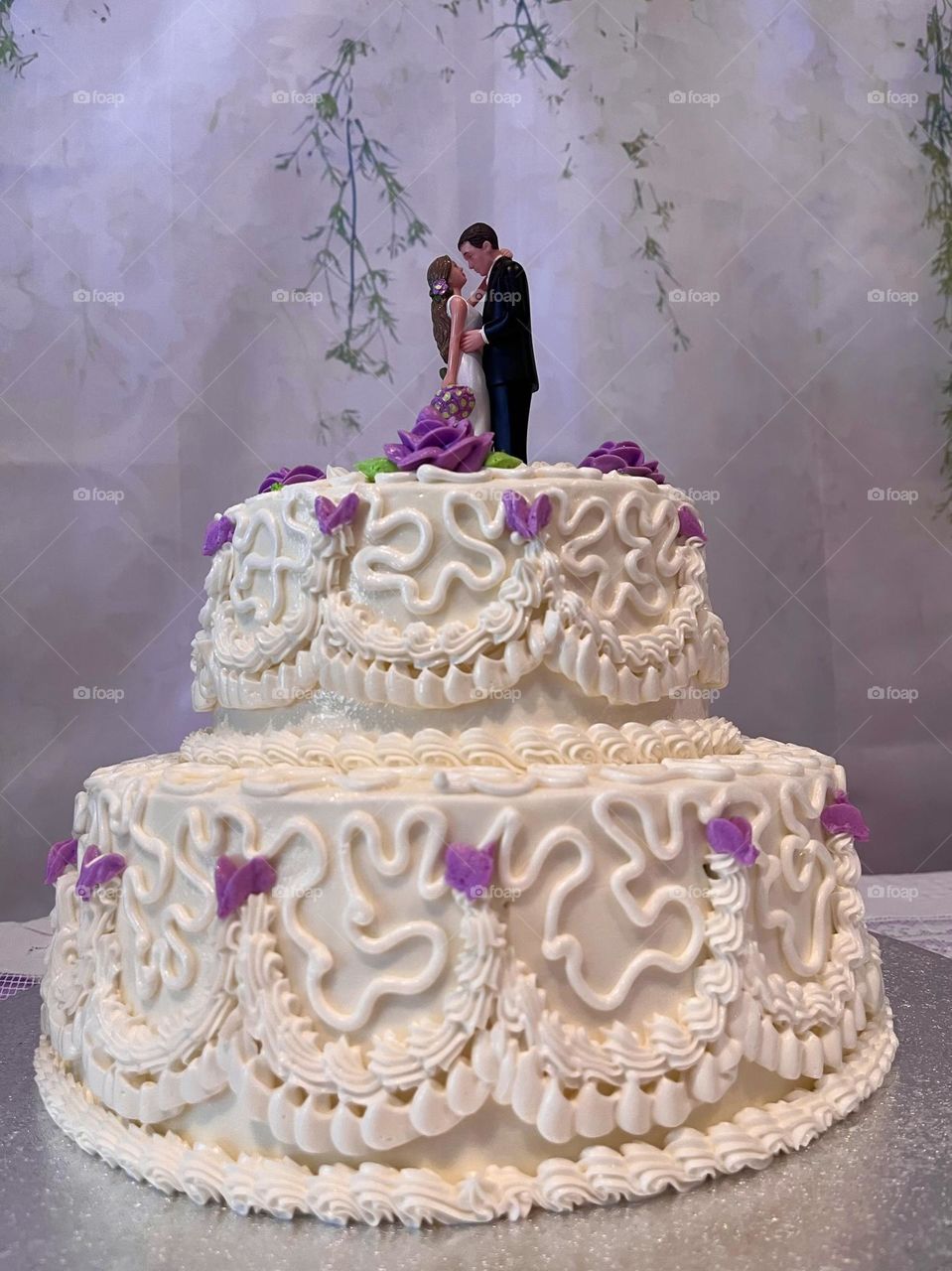 A beautiful purple and white wedding cake