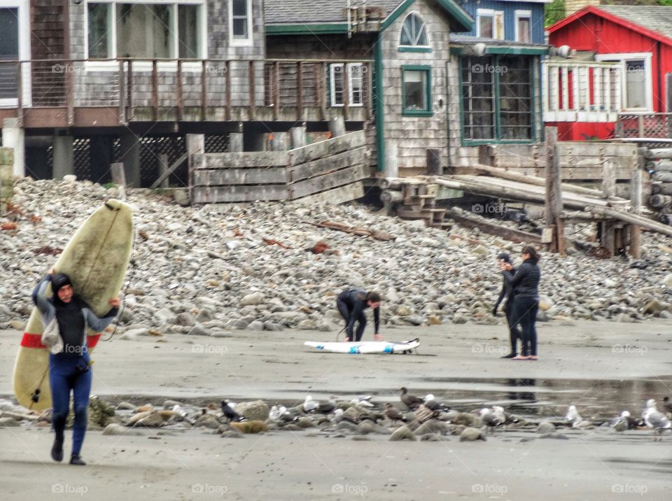 Surfers in the Northern California town of Pacifica