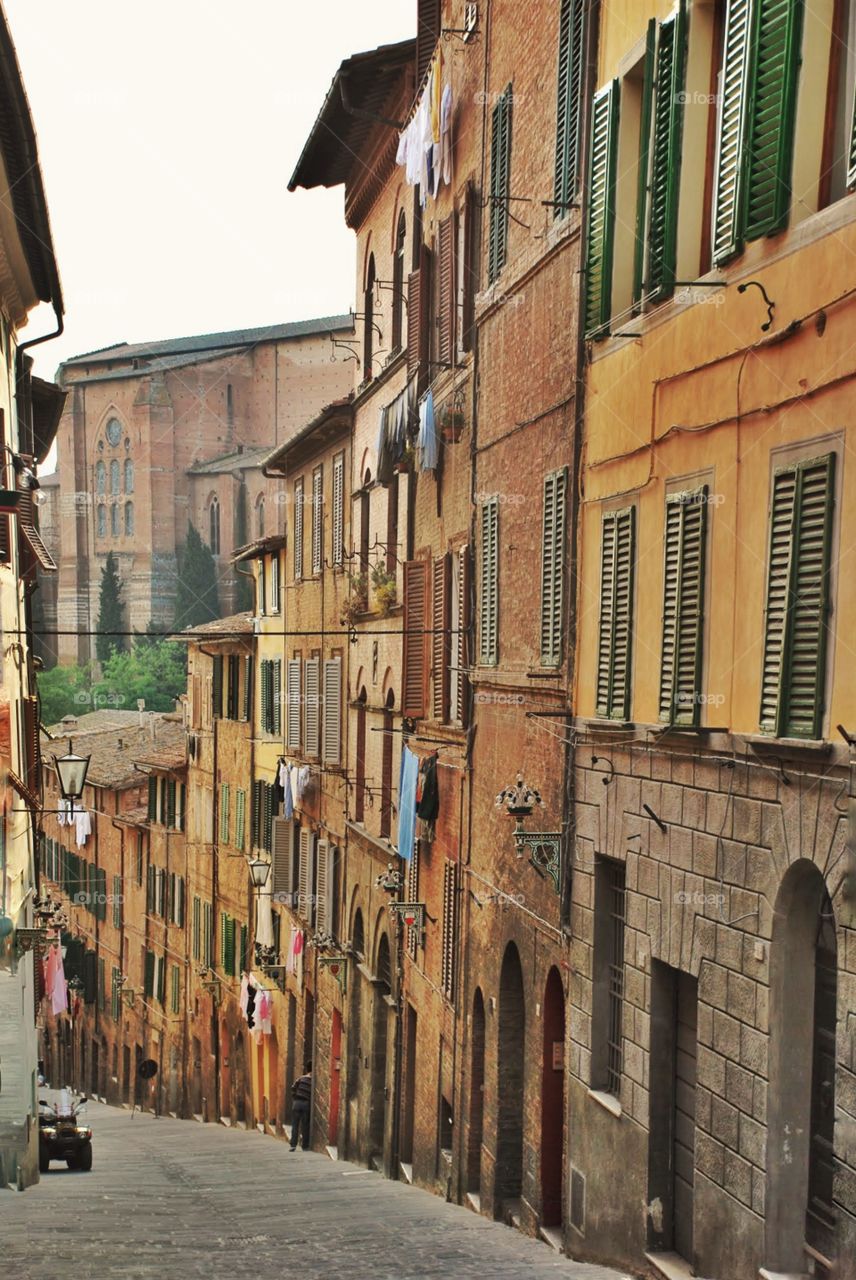 Sienna street scene. View down a cobblestone street in sienna Italy 