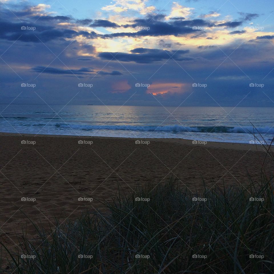 Calm blue sky beach sunrise 