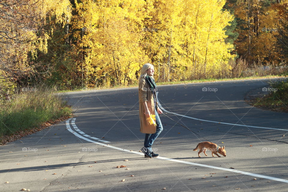 Woman walking with a dog 