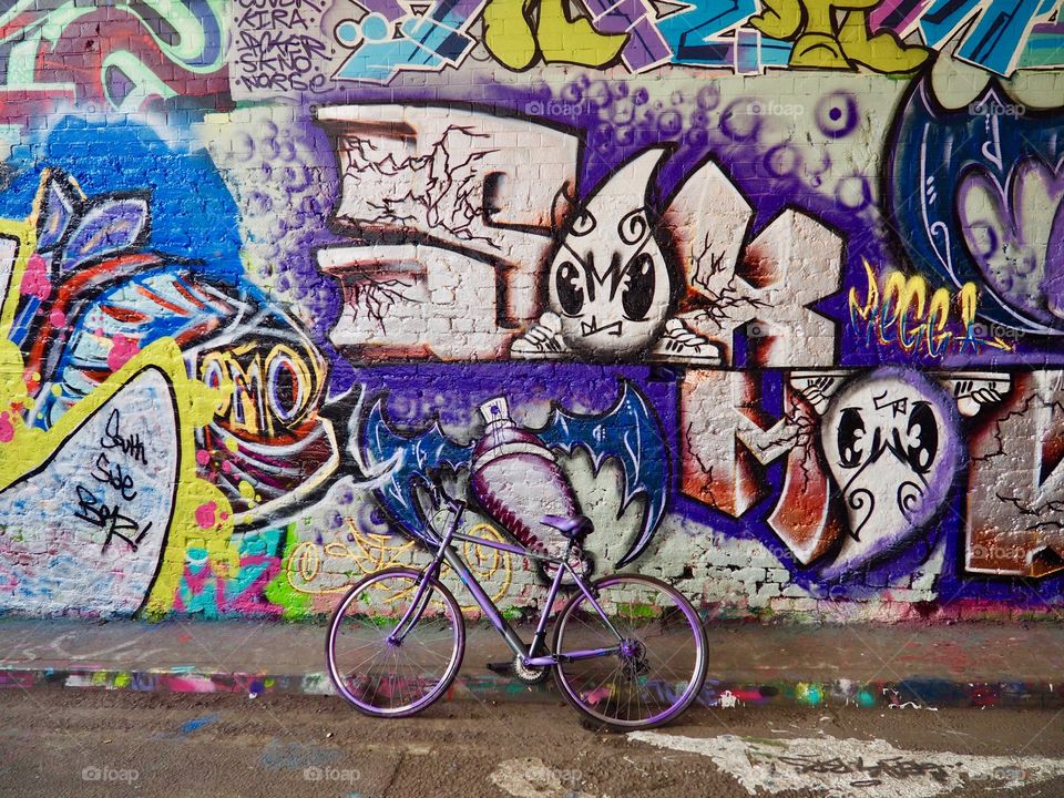 Graffiti and purple bike from Leake street tunnel in London.