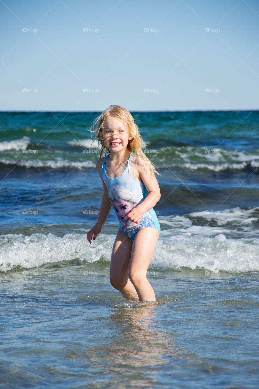 A little girl enjoying in sea