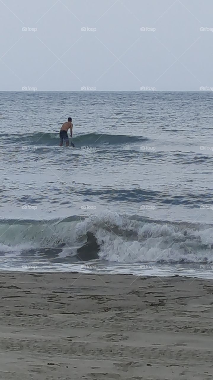 surfing over relax waters