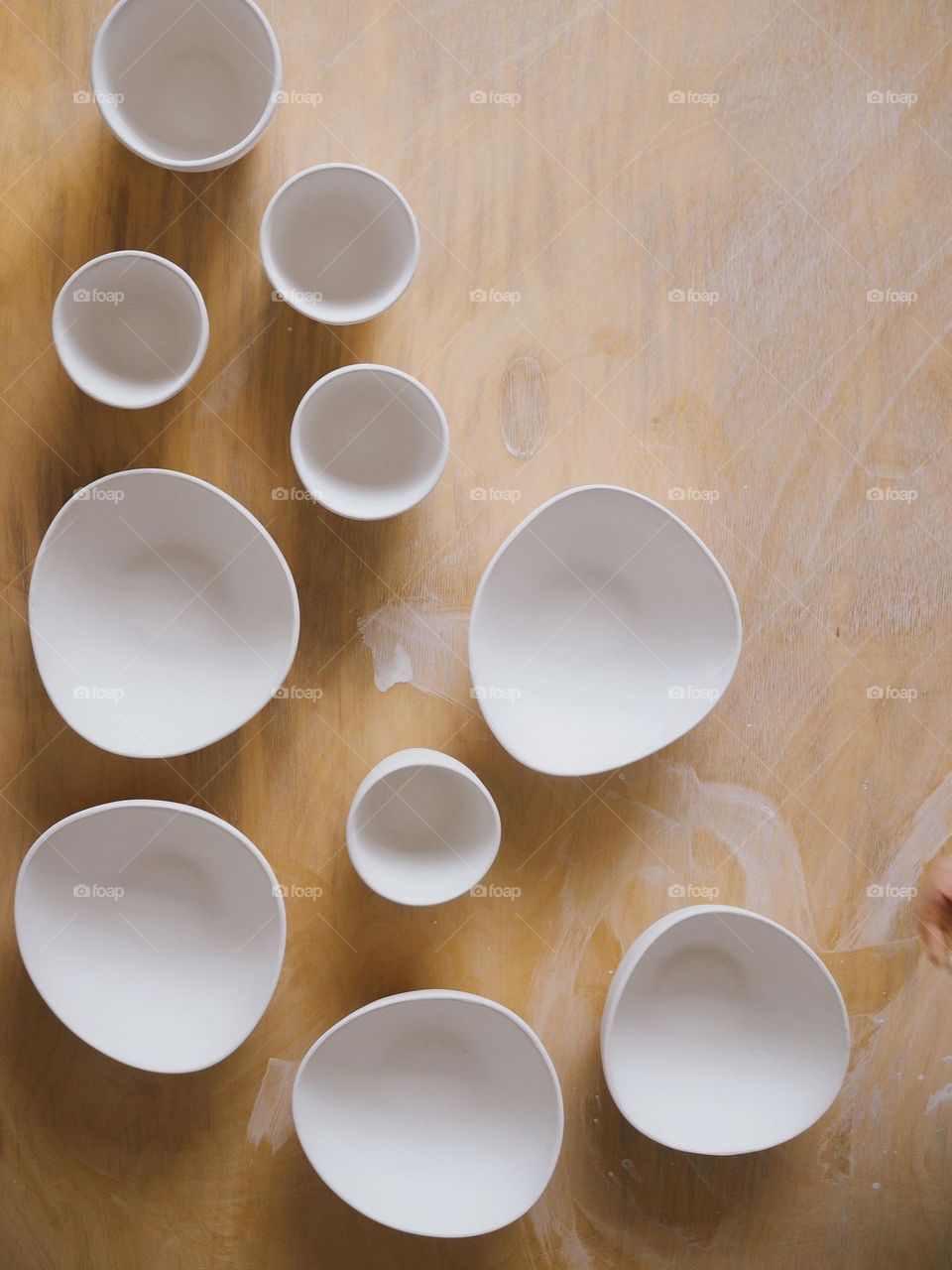 Round ceramic plates on a wooden table, top view, no people 