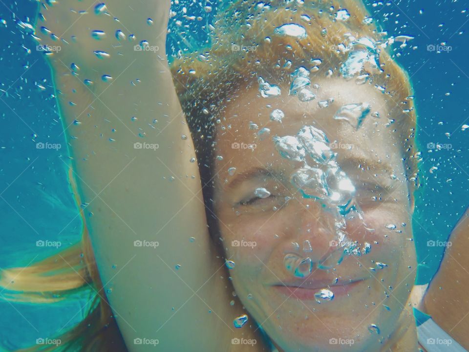 a swim in the blue waters of Cartagena, Spain