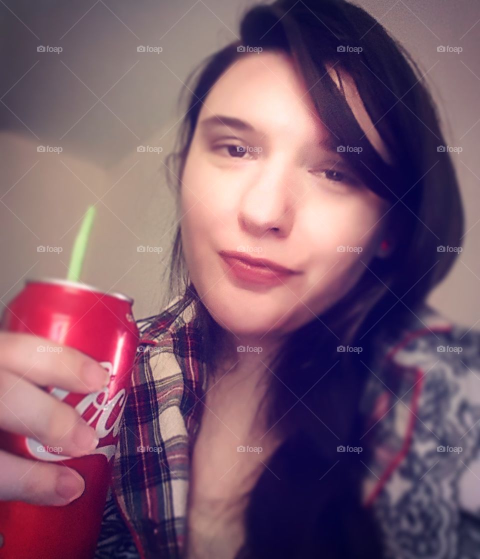 Content and happy, drinking a soda, feeling good and feeling pretty. That was a good day.