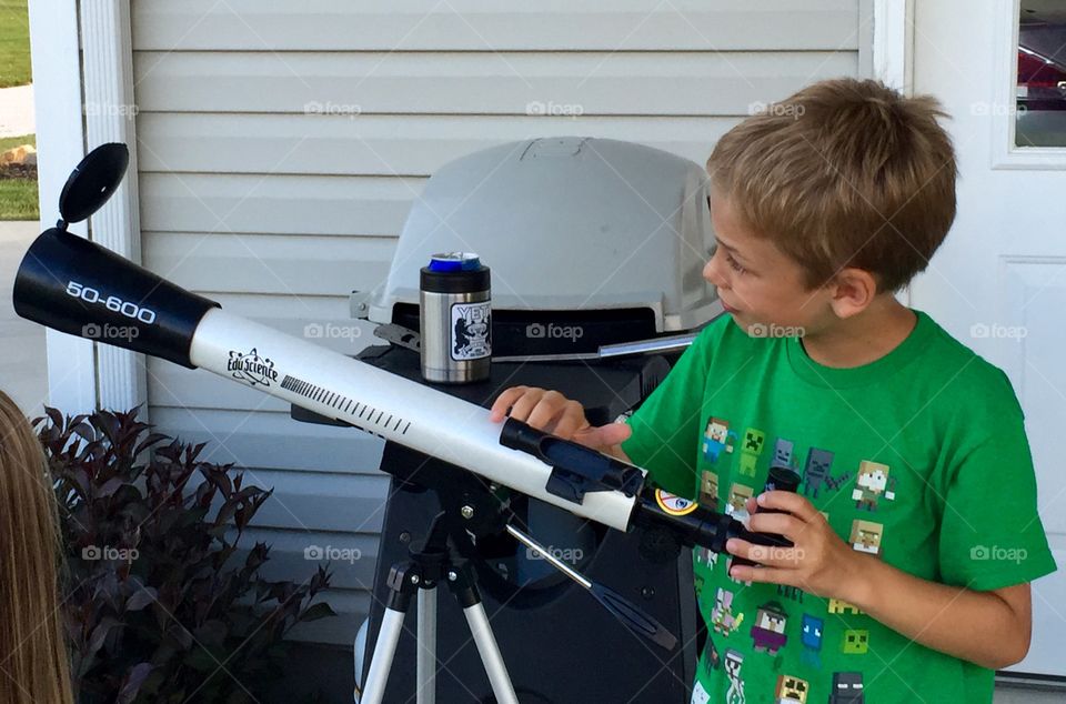 A boy and his telescope