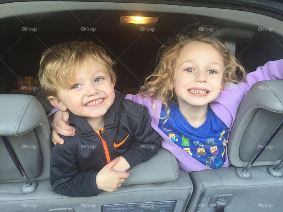 Brother and sister in car