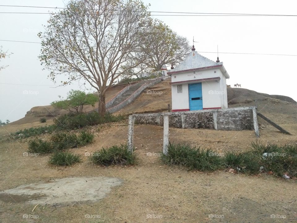A beautiful scene of Lord shiva's temple in the hill