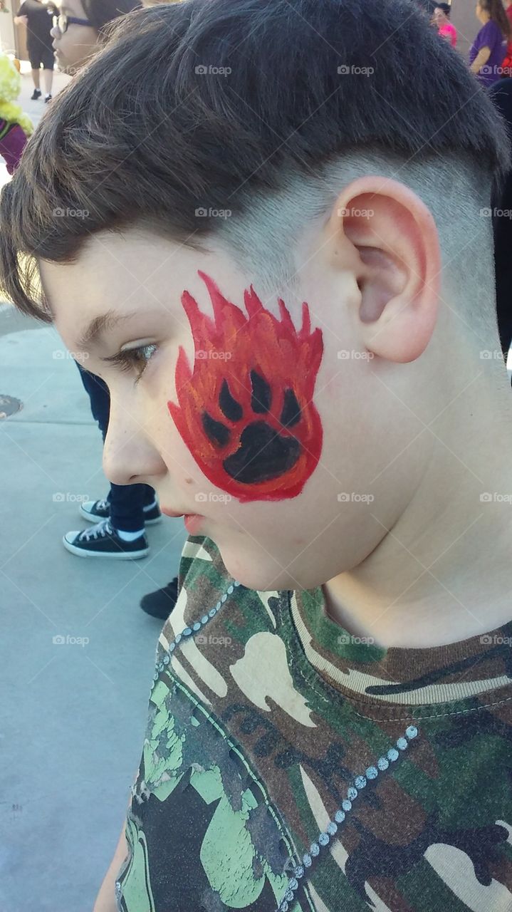 my nephew with face art at his school Book Fair