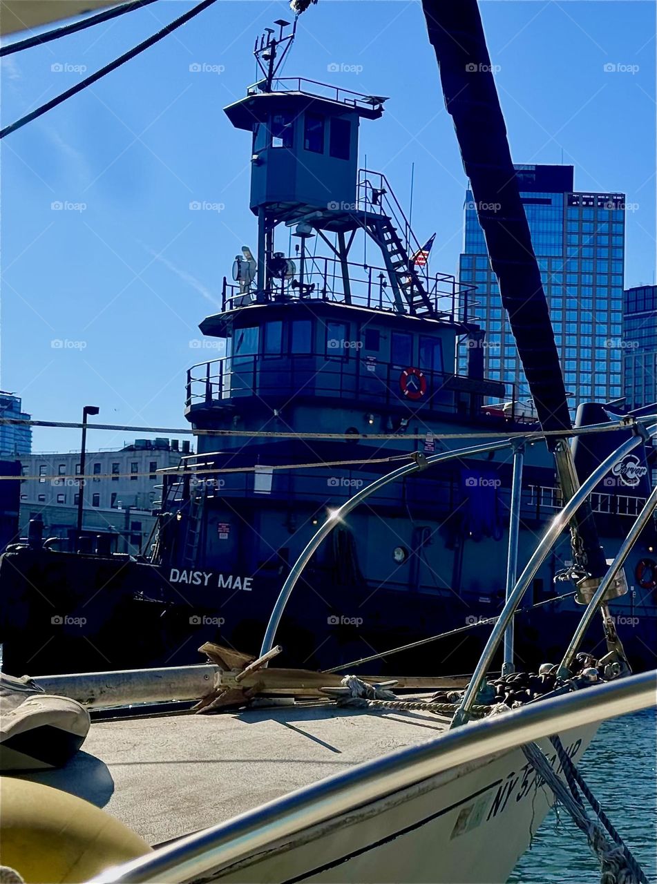 Many sea vessels pass by here right by our window. Some of them are quite large as this one here in transit past “Salvation”, our “28 ft 1969 Luhrs” cabin cruiser at “Newtown Creek” by the “Pulaski Bridge” in LIC, Queens. 2024. Hypnotic Productions