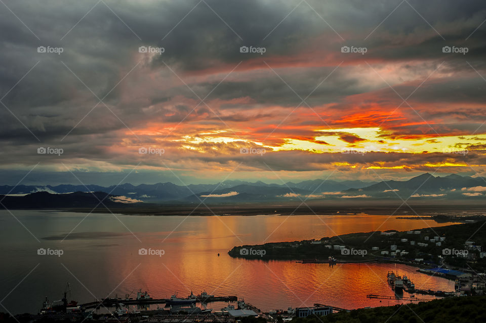 Incredibly colorful Kamchatka volcanic sunset over Avacha bay on the background of mountains and volcanoes