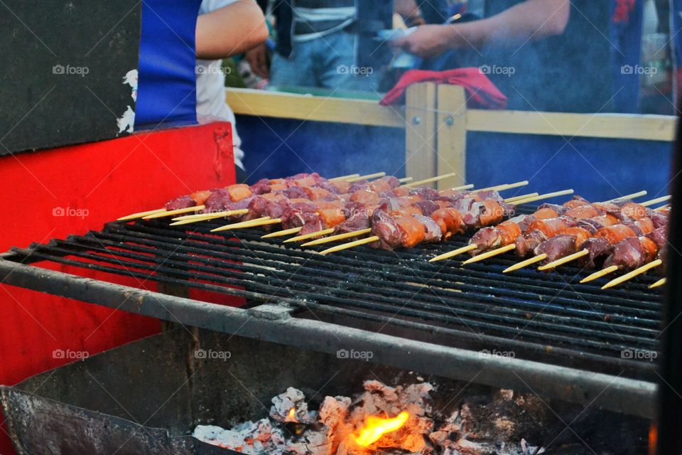 Kebabs on barbecue grill at food stall