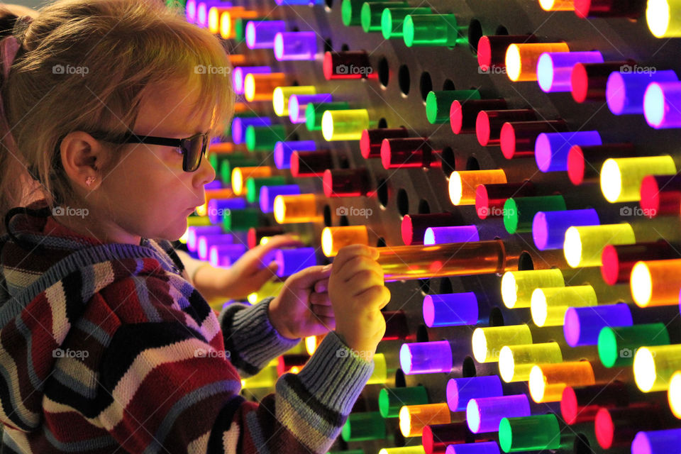 Little girl playing with light sticks