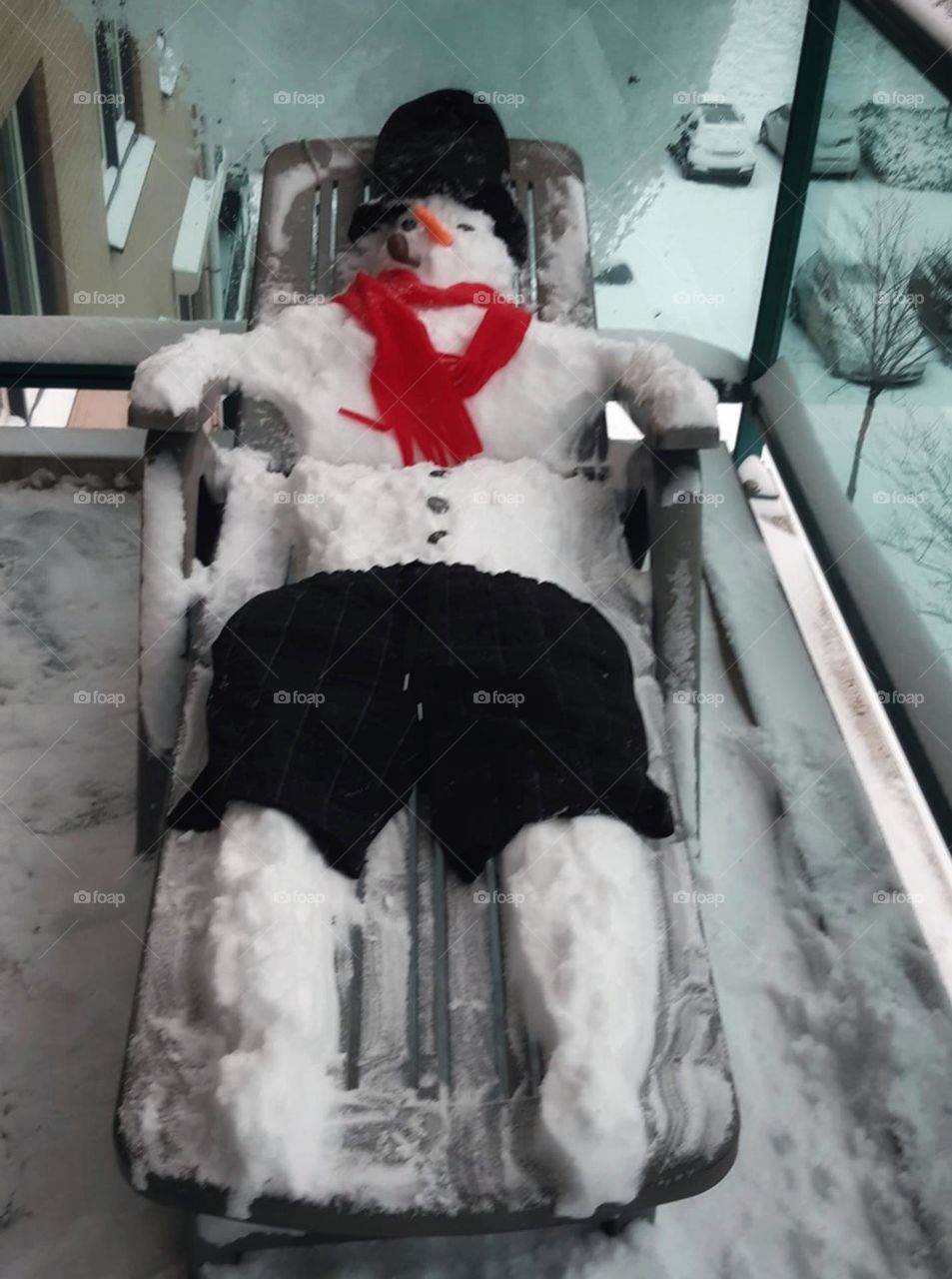 Snowman enjoys in a lounger