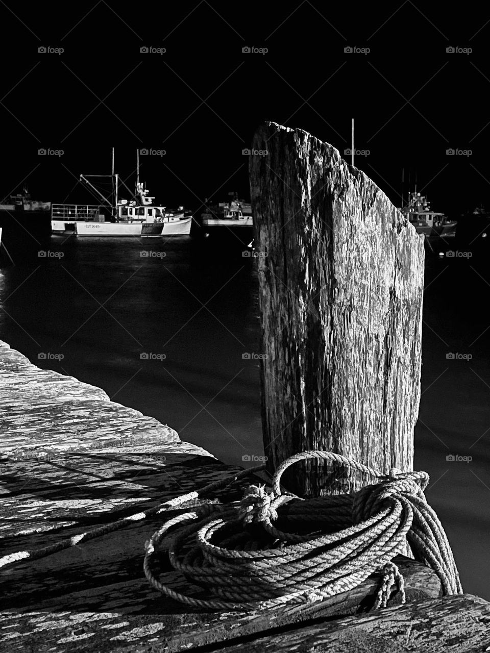 “Quiet Harbor Night.”  A piling at the town landing stands like a sentinel among the fleet of boats.