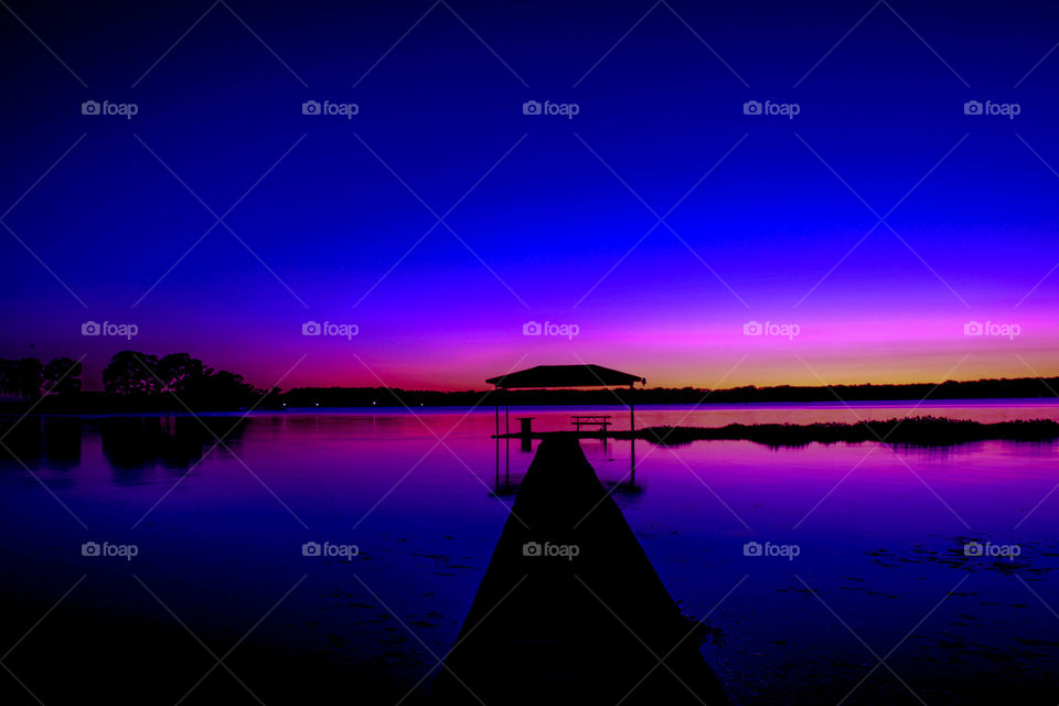 Purple and Blue sunset. This is a photogrpah of a purple and blue sunset over a lake.
