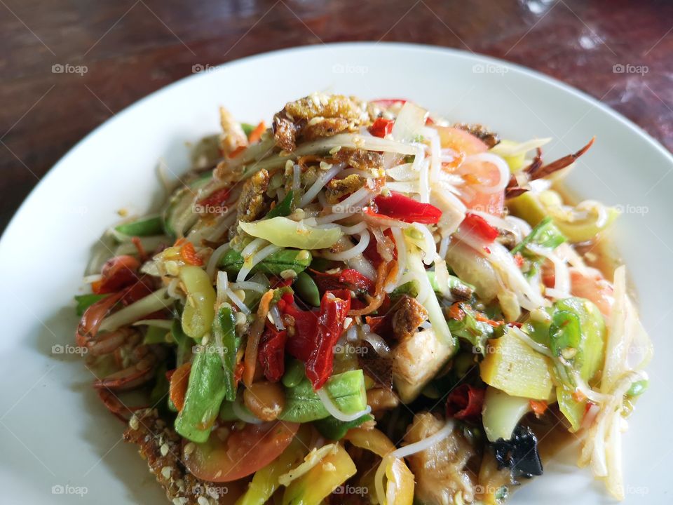 Som Tum (Papaya salad). Papaya salad with crab, pickled fish and a lot of chillis.