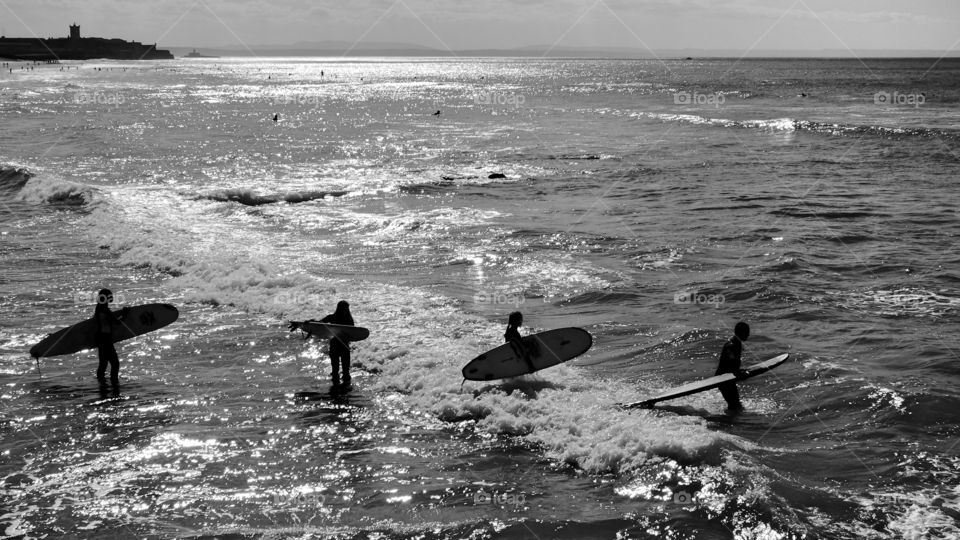 Surfers going to surf