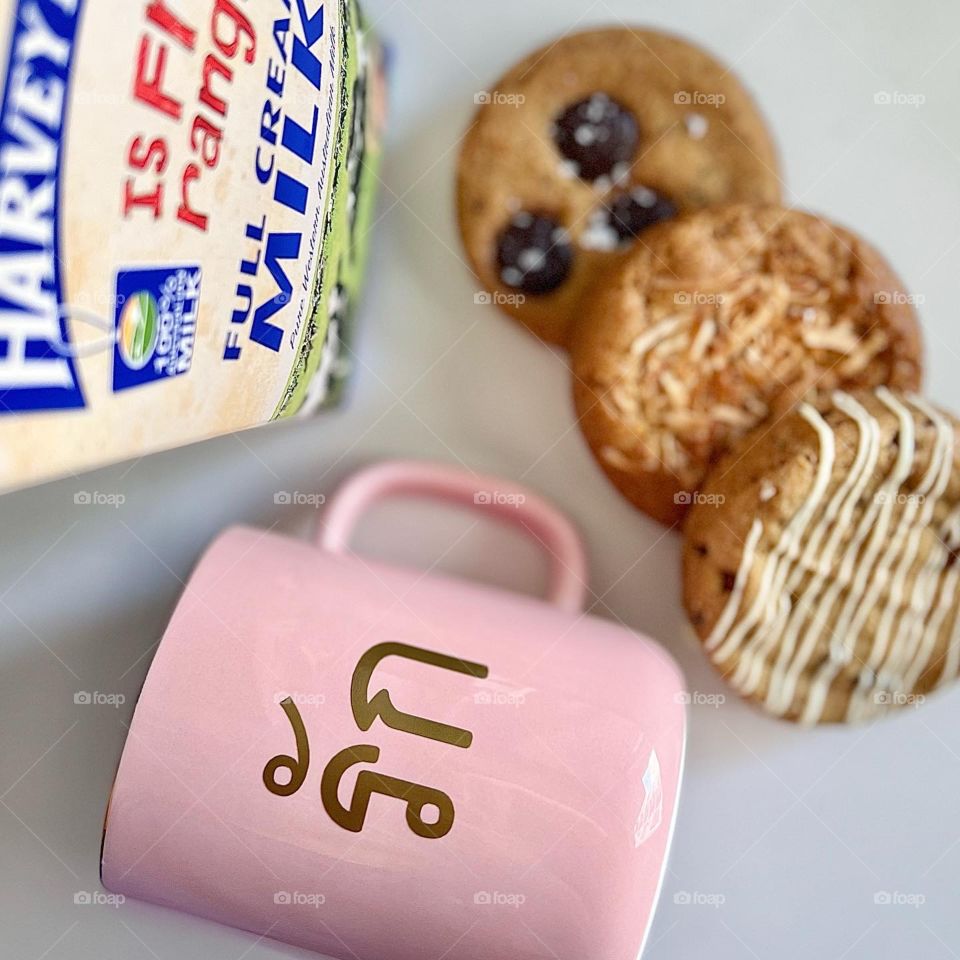 Homemade cookies and milk in pink mug
