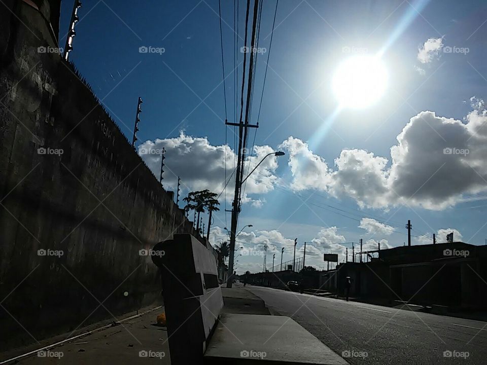 Empty bench at side walk