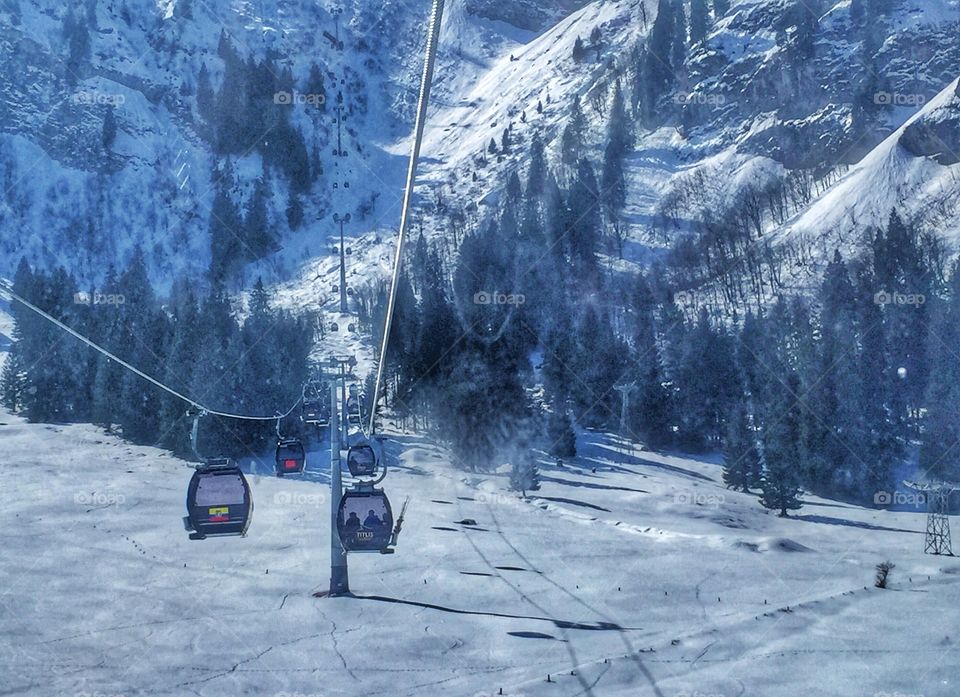 Cable car atop snowy mountain