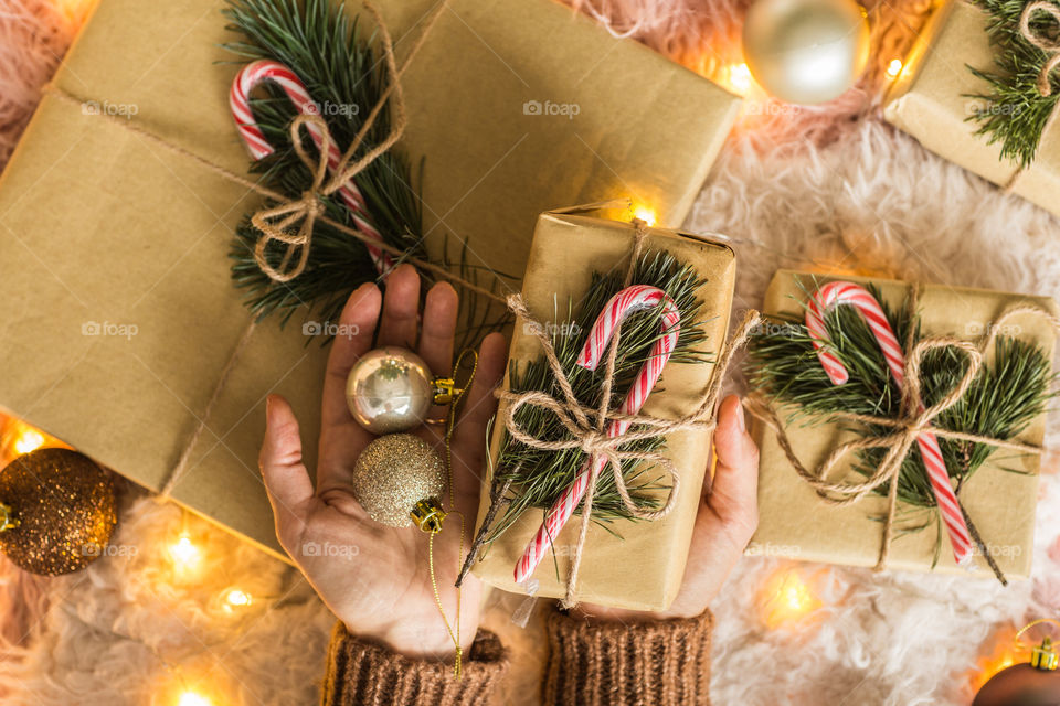 Christmas gifts and female hands 