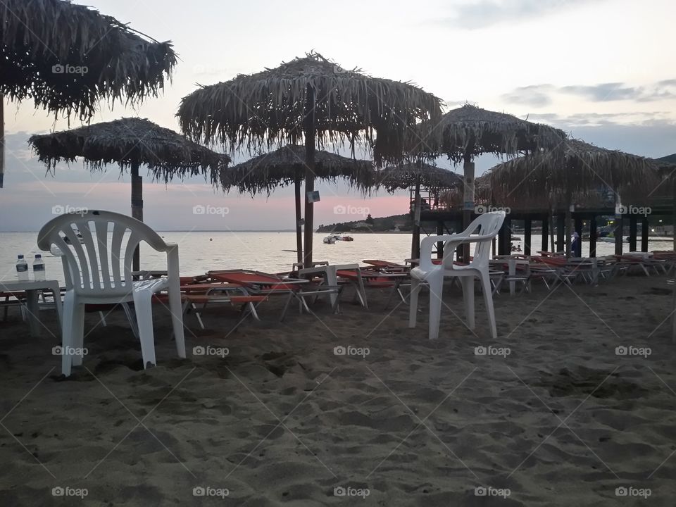 Sunbed and umbrella on beach