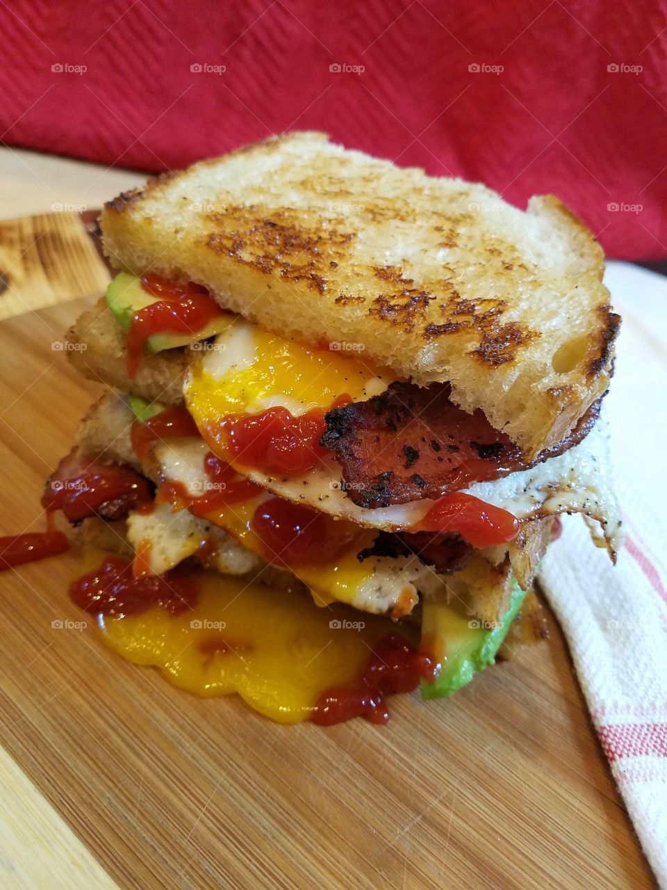 egg bacon avocado ketchup sandwich