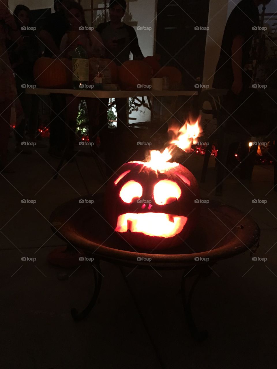 Scared pumpkins on fire at Halloween 