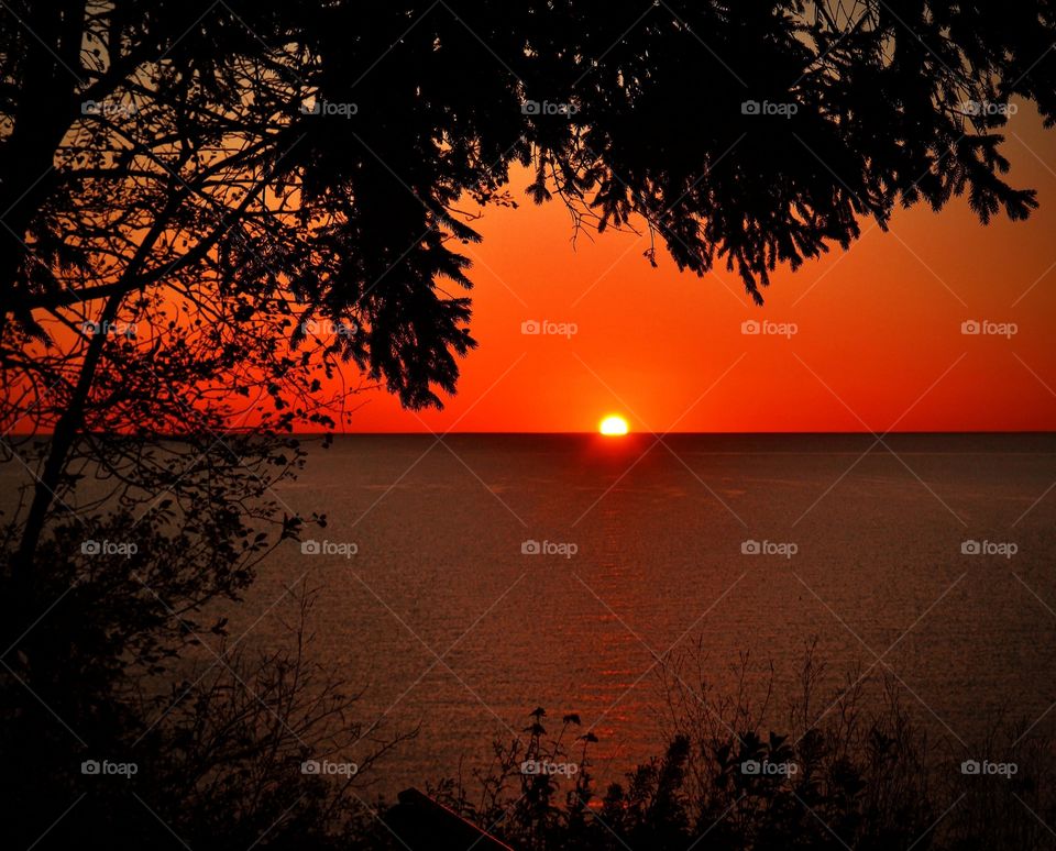 Sunrise. Bright orange sunrise over Lake Michigan