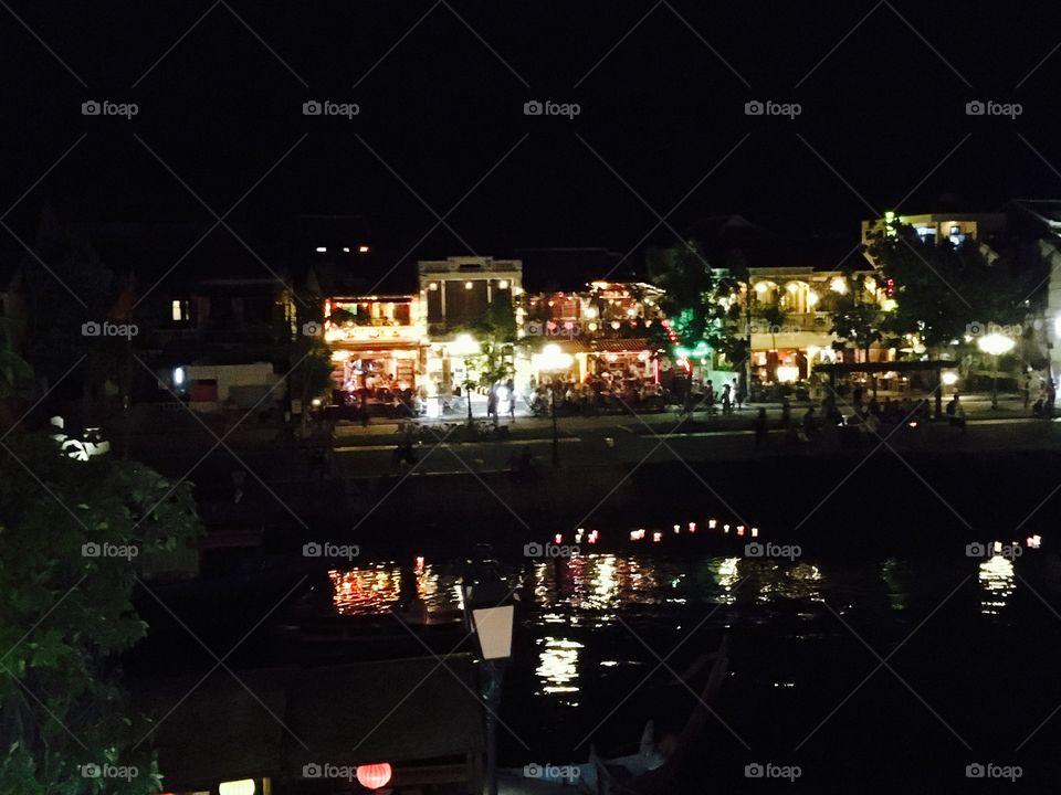 Thu Bon river that runs through Old Town Hoi An Vietnam   
Lanterns are launched in a blessing for the "Living". 